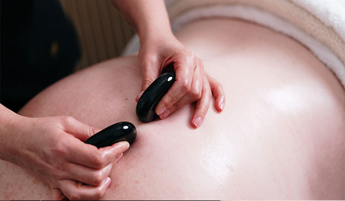 Man having hot stone massage