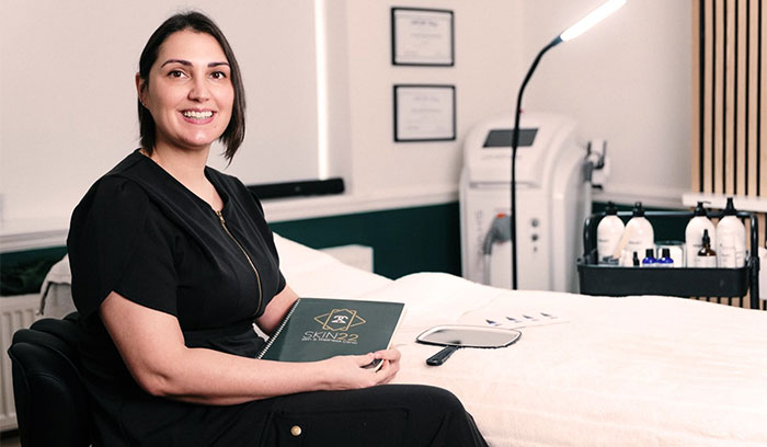 Middle aged lady receiving skin consultation in Ruthin